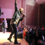 JJ Hairston on stage arm up