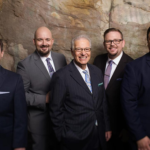 The Kingsmen brown wall