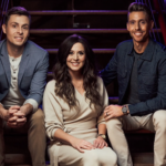 The Taylors, seated on steps