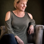 Lisa Tawn Bergren seated