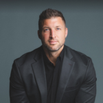 Tim Tebow black suit